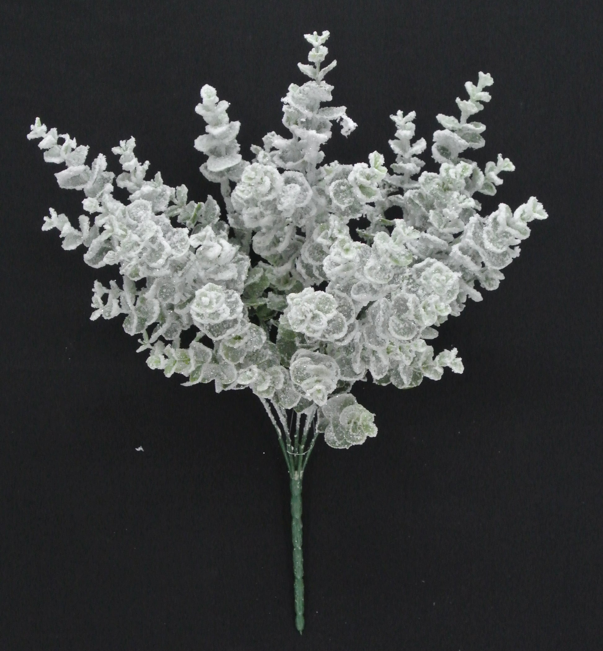 A bouquet of delicate white flowers with long stems, arranged against a dark background.