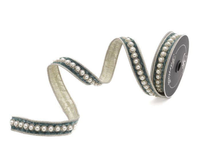 A decorative ribbon with a beige and blue pattern, adorned with small white pearls.
