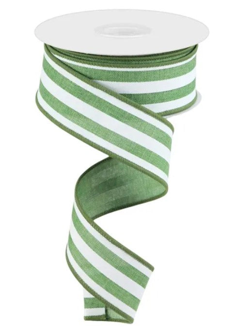A spool of green and white striped ribbon is shown against a white background.
