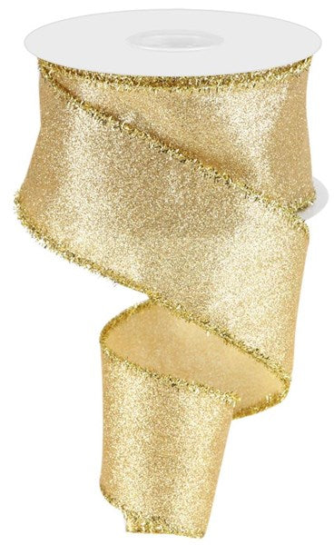 A gold glittery ribbon is shown against a white background.