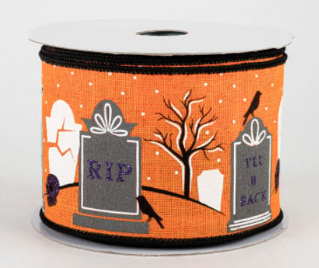 a roll of halloween ribbon with tombstones on it