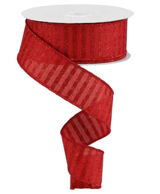 A roll of red, shiny, metallic ribbon with a repeating striped pattern.