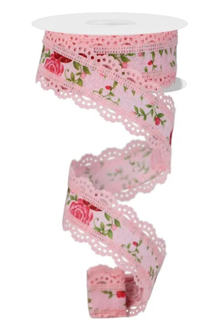 A pink floral lace ribbon with a scalloped edge and a floral pattern.
