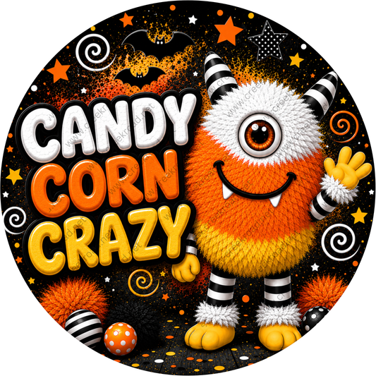 a large, colorful monster with a candy corn design, surrounded by Halloween-themed elements such as stars, bats, and a bat.