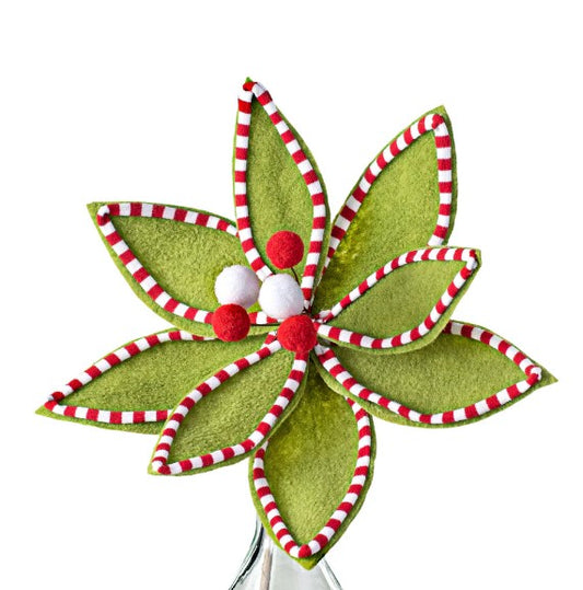 a green flower with red and white stripes on it