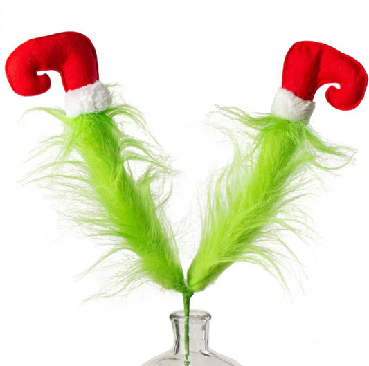 a pair of green feathers with santa hats on them