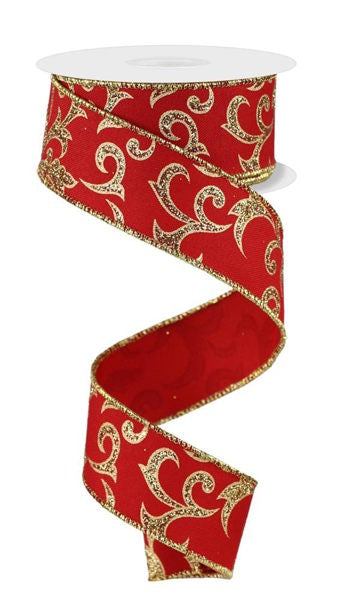 a roll of red and gold ribbon with gold swirls