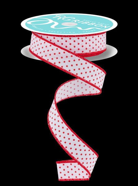 a red and white polka dot ribbon on a black background