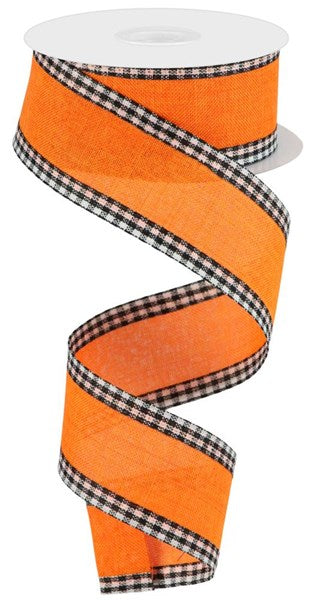 a roll of orange and black checkered ribbon