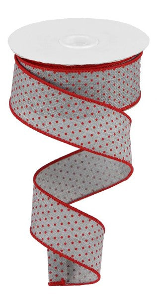 a roll of red and white polka dot ribbon