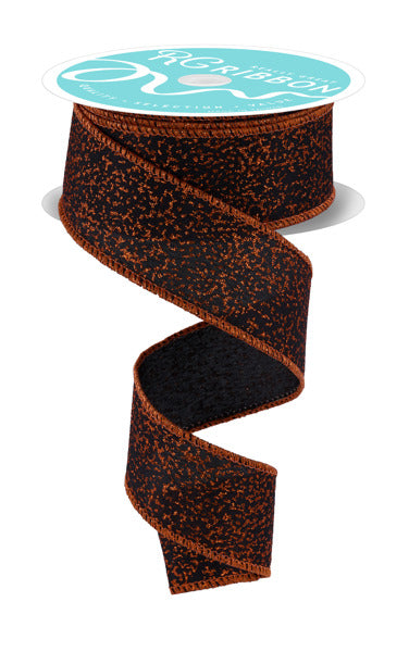 a spiral-shaped brown and black fabric ribbon with a turquoise label on top.