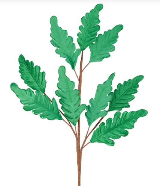 A branch with green leaves, resembling a plant or tree.