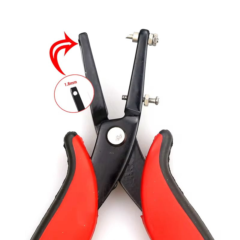 a pair of black and red pliers on a white background