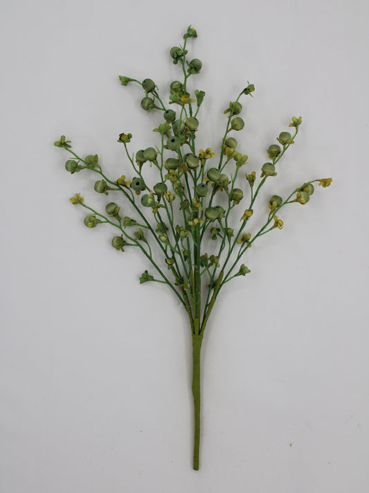 A single green stem with small yellow flowers protruding from it, arranged in a vertical fashion against a plain white background.