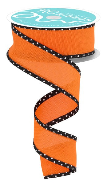 a roll of orange and black polka dot ribbon