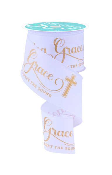 a roll of white paper with gold lettering on it