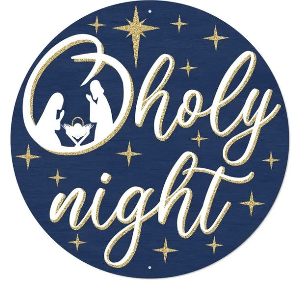 A circular sign with a blue background and gold stars, featuring the text "oholy night" and silhouettes of a nativity scene with two figures, one of which is a baby.