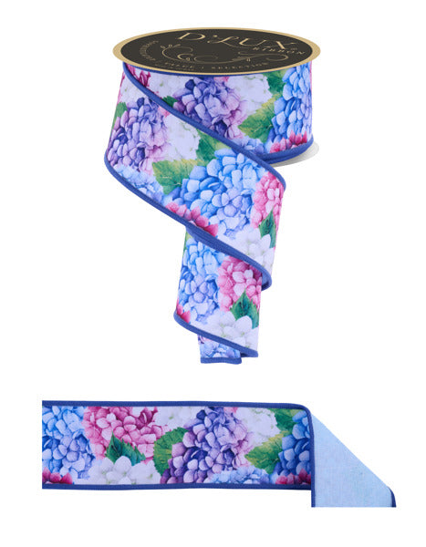a roll of blue and pink flowers on a white background