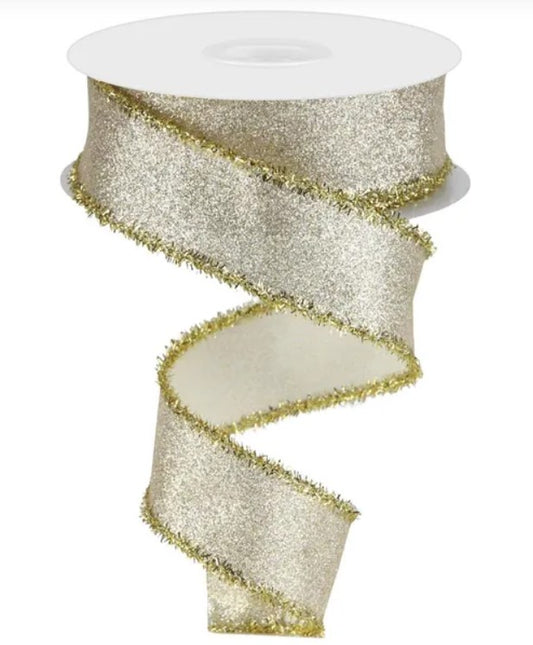 A silver glittery ribbon with gold fringe is shown against a white background.