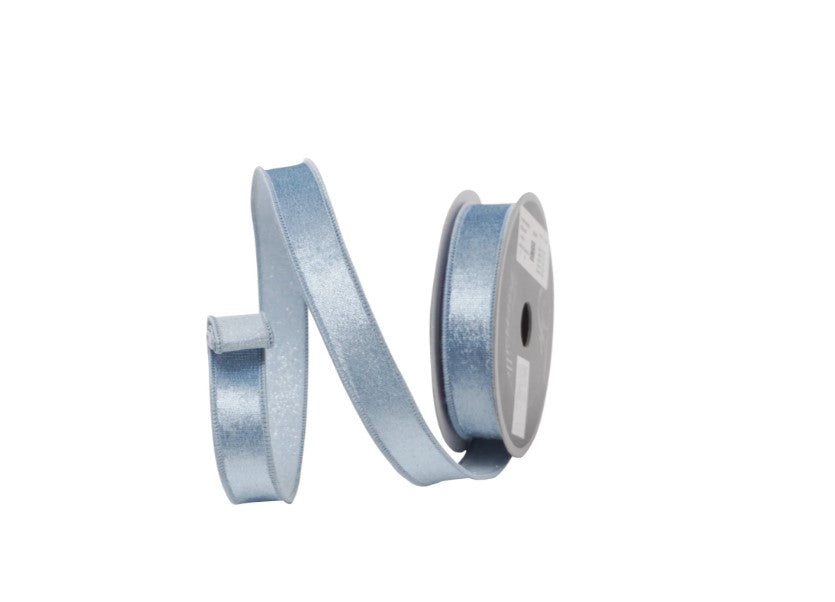 A roll of light blue ribbon with a silver spool attached, against a white background.