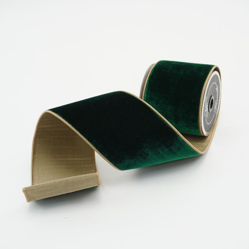 a roll of green velvet tape on a white background