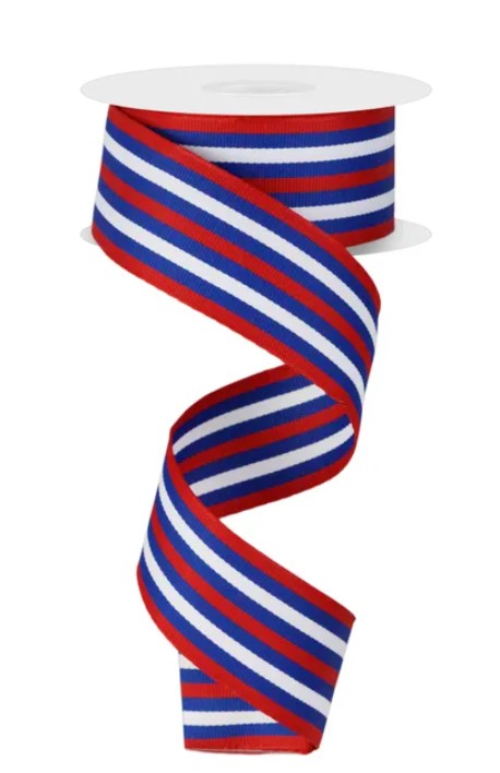 A spool of red, white, and blue ribbon with a spiral pattern.