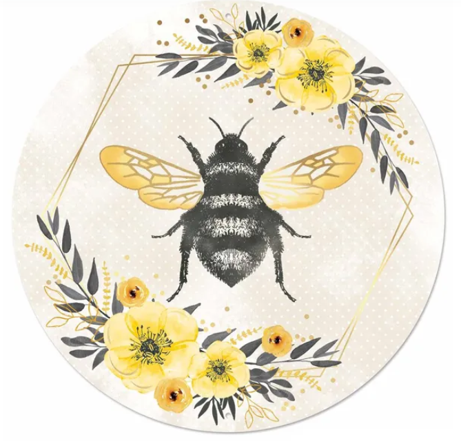 A round, floral-designed plate featuring a black and yellow bee surrounded by yellow flowers and leaves.