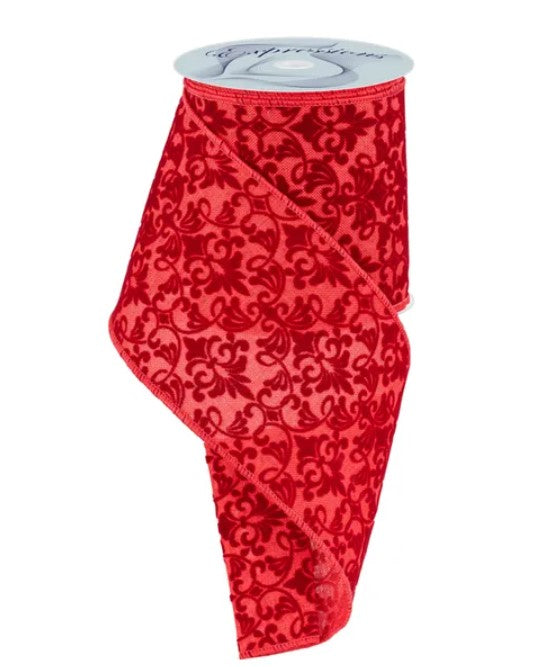 a red ribbon with a black floral pattern.
