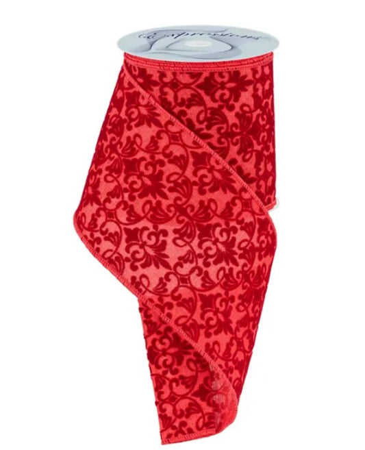 a red ribbon with a black floral pattern.