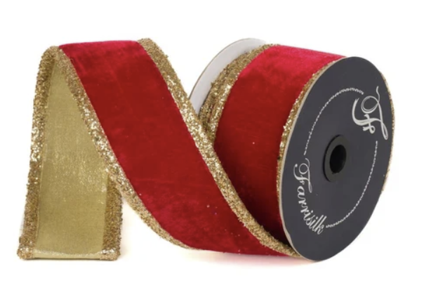 A roll of red velvet ribbon with gold glitter trim, displayed against a white background.