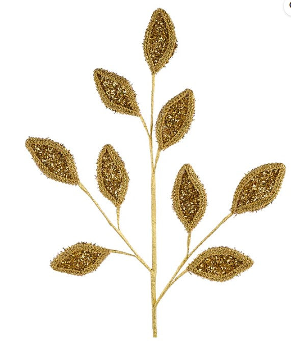 A branch with gold glitter leaf-shaped ornaments attached to it.
