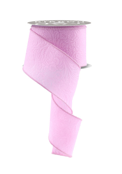 a roll of pink ribbon on a white background