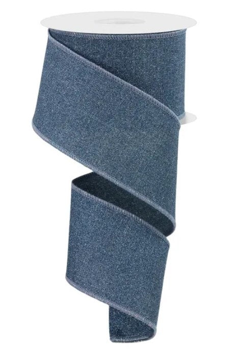 A roll of blue denim-like ribbon with a white base.