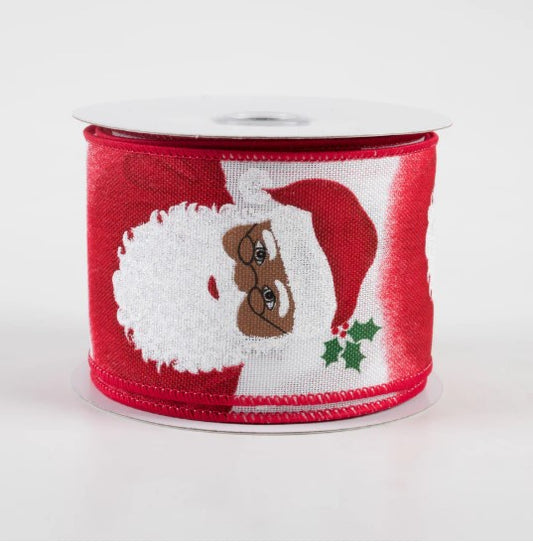 A red and white Christmas ribbon with a Santa Claus design on it.