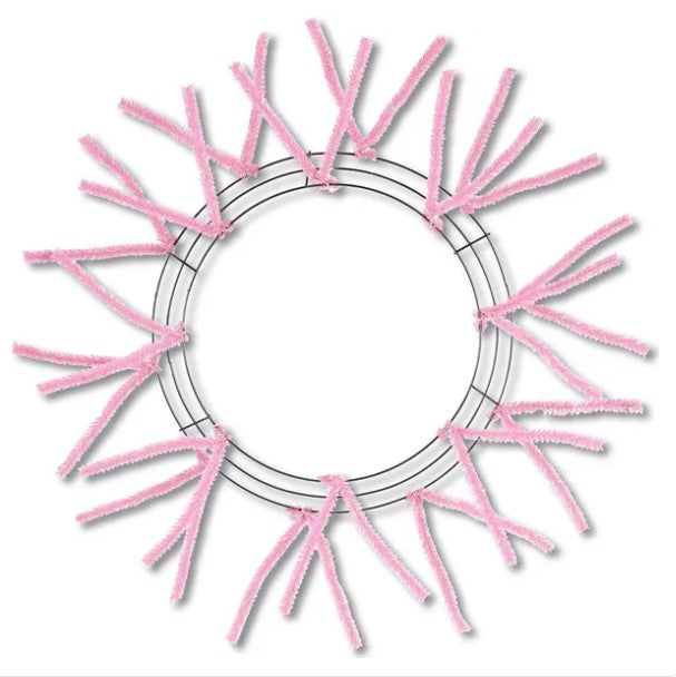 a circular frame made of pink pipe cleaners arranged in a radial pattern.
