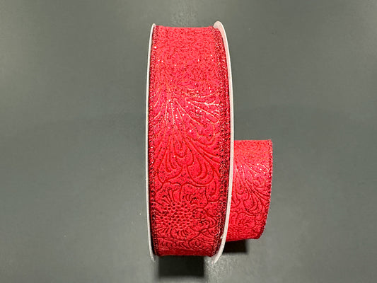 a red ribbon with a flower pattern on it