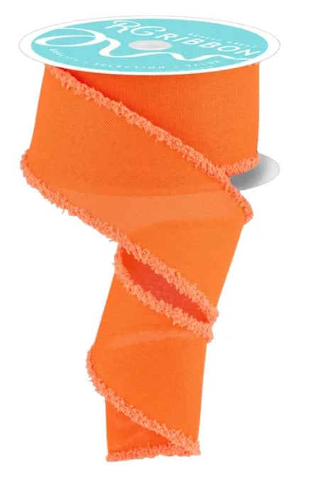a roll of bright orange, fringed ribbon with a turquoise label.