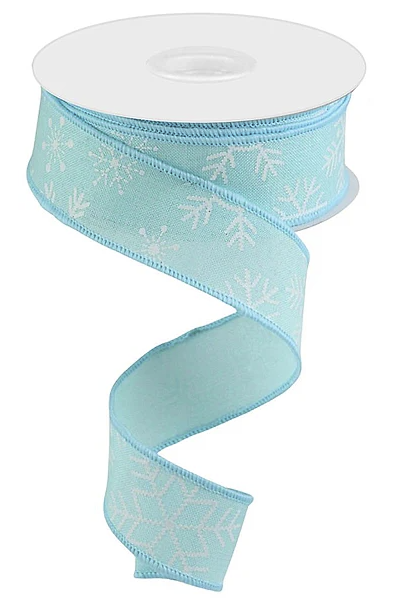 A turquoise ribbon with white snowflake patterns is shown, with the ribbon winding around itself.