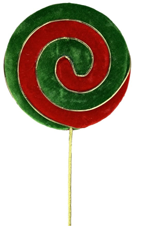 a green and red lollipop on a stick