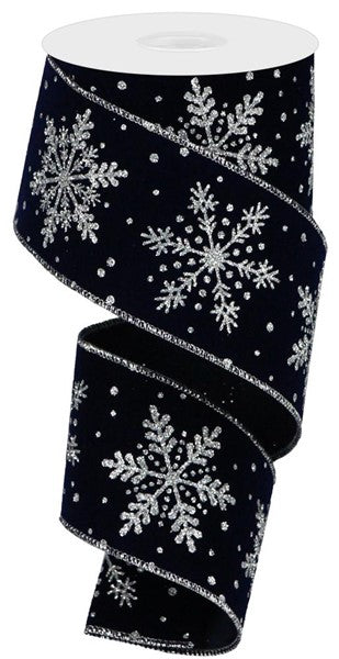 a black ribbon with white snowflakes on it