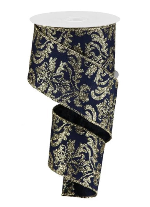 A roll of dark blue and gold glittery ribbon with a repeating floral pattern.