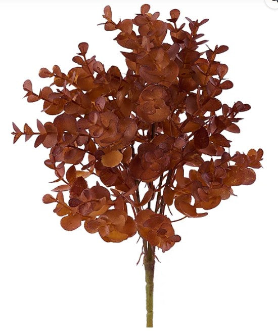 a cluster of brown, leafy branches or leaves, possibly resembling a tree or a plant, with a reddish-brown color.
