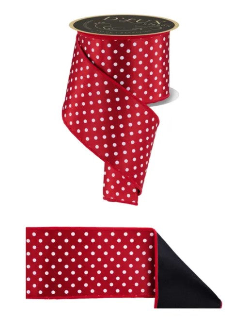 a red ribbon with white polka dots, and it is displayed in two different ways: one as a full-length ribbon and the other as a smaller, folded piece of the same ribbon.