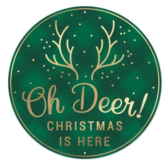 A green circular sign with gold text and a deer antler design.