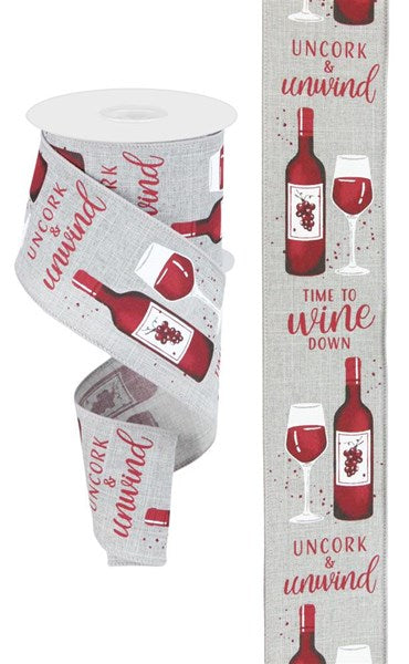 a wine bottle and two wine glasses on a white background