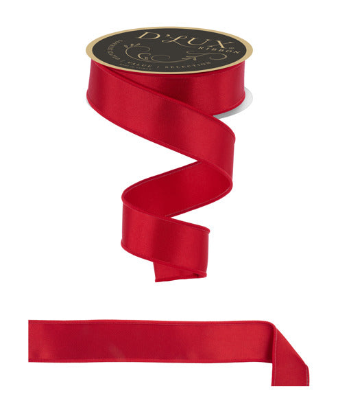 a roll of red satin ribbon on a white background