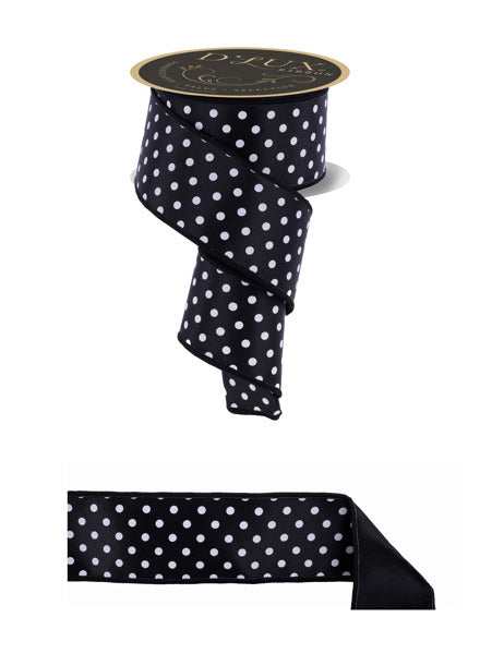 a black and white polka dot ribbon with a gold label.