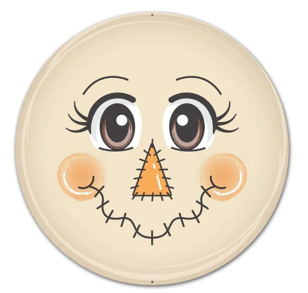 A round, beige plate with a cheerful, cartoon-like face design featuring large eyes, a big nose, and a smiling mouth.