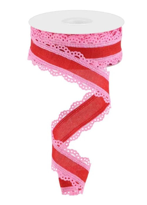 A pink and red ribbon with a lace-like pattern on it.
