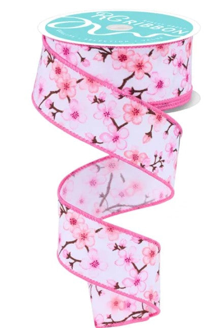 A pink floral patterned ribbon with a teal background.